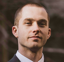 Thomas Whitfield, analista di trading ed esperto di mercati crypto, headshot.